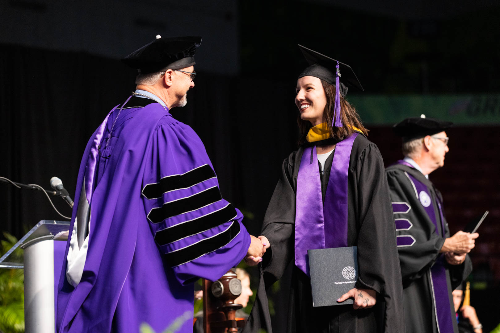 Graduate Isabel Zimmerman receives her master’s degree in data science during Florida Polytechnic University’s 2023 commencement at the RP Funding Center in Lakeland, Florida, on Sunday, May 7. More than 200 students received their degrees at the graduation ceremony.